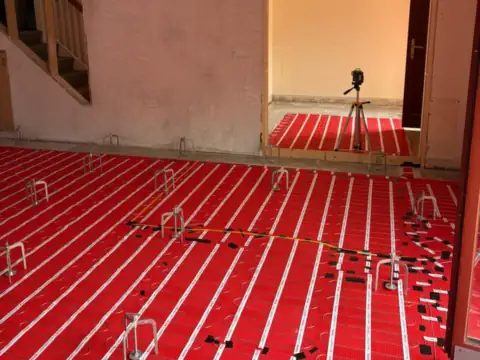 Laser set up to level the compound, JAM Floor Screeding