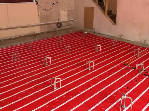 Low-profile underfloor heating for a renovation, JAM Floor Screeding