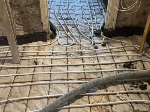 Underfloor heating in a stone house renovation, JAM Floor Screeding
